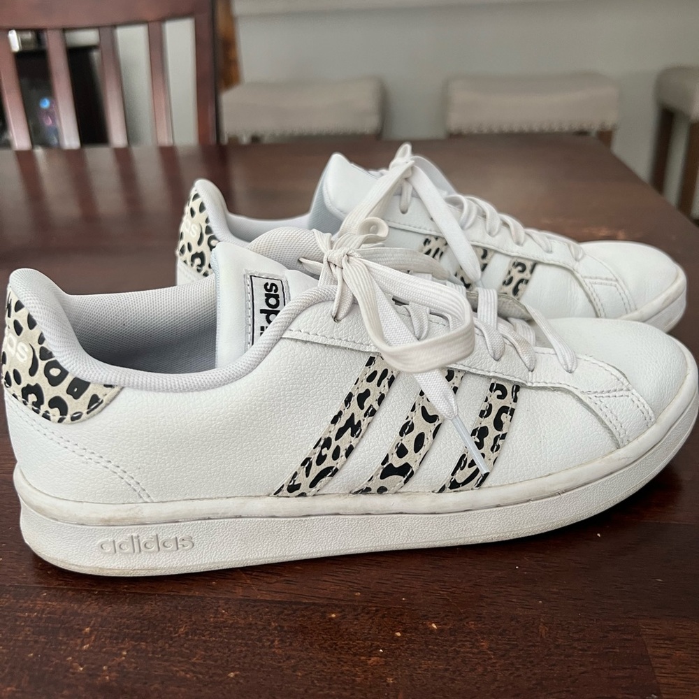 Adidas white sneakers with leopard stripes